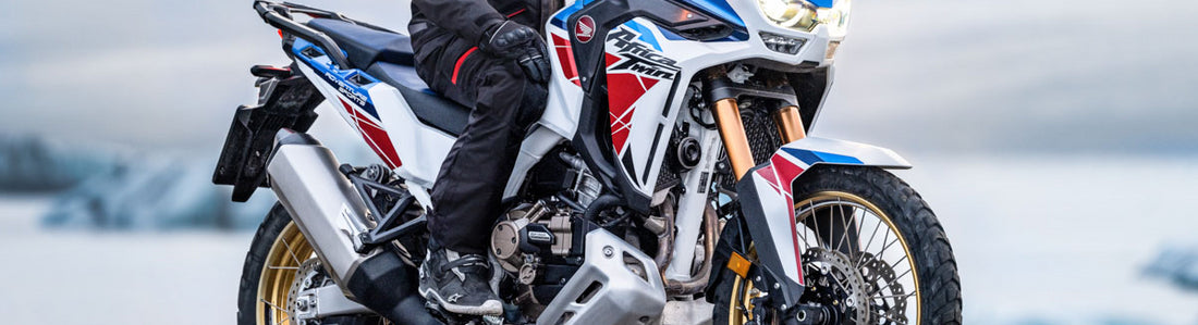 Adventure Rider on Africa Twin advertising Adventure Pants and Gear