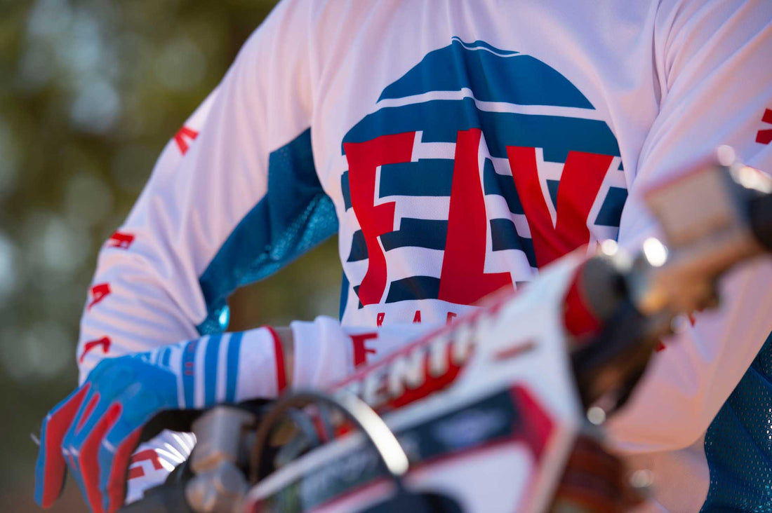 Motorcross Rider Wearing white and blue Fly MX Jersey