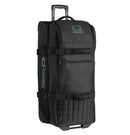 The Ogio TRUCKER Gear Bag - Black by Ogio is a rectangular rolling duffel bag featuring a padded handle on top, separate compartments, and a retractable handle. The bag displays dark grey OGIO logos on the front and sides, has two compression straps around the middle, and is made with eco-friendly PVC construction.
