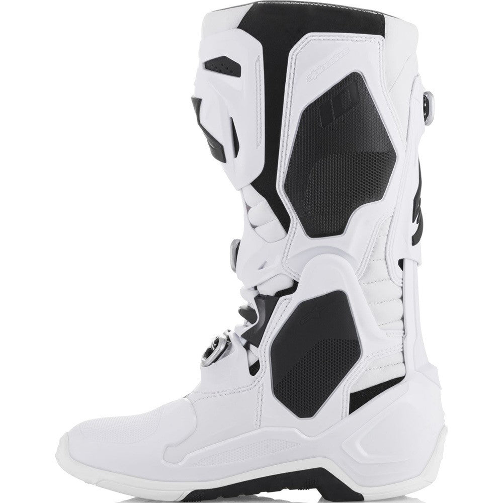The Alpinestars Tech-10 MX Boots White by Crown Kiwi Enterprises Limited are lightweight motocross boots in white and black, featuring an angular design with multiple buckles, prominent branding, reinforced protective areas, and a Dynamic Heel Compression Protector for style and safety.
