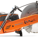 A Husqvarna K1270-16 17" Power Cutter with an orange and black body, large circular blade, and ergonomic handle. The brand logo is visible on the tool. Ideal for heavy-duty cutting tasks, this robust machine is perfect for both construction sites and outdoor projects like maintaining lawns.