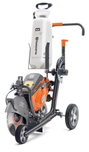 A professional-grade concrete cutting machine with an integrated water tank for dust suppression, perfect for outdoor use. The Husqvarna KV970 Power Cutter trolley is equipped with a powerful large circular saw blade, sturdy frame, and wheels for mobility across lawns. The water tank proudly displays the Husqvarna logo.