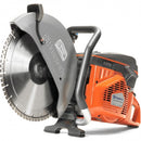 The image shows an orange and gray power tool, specifically a Husqvarna K970 - 14" MK3 concrete saw, ideal for heavy-duty cutting tasks. Its large circular blade and handle ensure precise maneuvering outdoors, making it perfect for maintaining lawns and other outdoor projects.