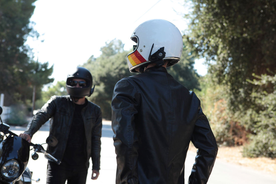Motorcycle Road Riding gear, man wearing a white helmet and black motorcycle jacket
