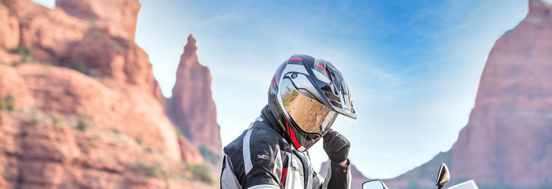 Motorbike rider wearing a Shoei Adventure helmet in the canyons 