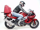 The image shows a Ventura Aprilia SL 1000 Falco Y (2000) Bike-Pack Kit, featuring a sleek black pack and versatile Evo-Rack on a Honda bike. An L-bracket with screws is included, and labels highlight the adjustable features of this innovative pack-rack system.