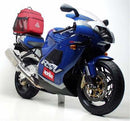 Image showing a Ventura EVO-12 Bike-Pack Kit for Aprilia RSV Mille (00-03) with three components: EVO-12 pack, Evo-Rack mounted on the motorcycle, and L-Bracket with screws, labeled as a generic image.
