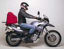 The image features the Ventura EVO-12 Bike-Pack Kit for the BMW F 650 GS, Y (2000). It consists of a sleek black bike pack with zippers and a logo, an Evo-Rack for easy mounting, and an L-bracket with screws, displayed on a Top-Box Rack on a bike.