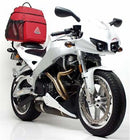 Image showcasing the Ventura Sport-Rack kit for Buell 984 Firebolt XB9R (03-04), featuring a black EVO-12 pack with a zipper and including an Evo-Rack mounted on a bike. The L-Bracket, displayed separately with screws, allows easy attachment.