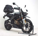 The image features a Ventura EVO-12 Bike-Pack Kit for the Buell 1200 Lightning Super TT XB12STT (2007), showcasing the EVO-12 pack, a black storage bag with a red stripe, an EVO-Rack, rear bike rack, L-Bracket with screws, and an Adjustable Pack-Rack for added utility.