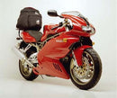 Image of the Ventura Ducati 900 SS Bike-Pack Kit, featuring a sleek black EVO-12 pack with a red stripe, an Evo-Rack mounted above the rear wheel, and a sturdy L-bracket with screws for easy installation.