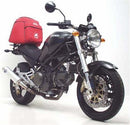 The image features a Ventura EVO-12 Bike-Pack Kit attached to a bike, including a black EVO-12 pack and an adjustable Pack-Rack. The Ducati M600 Monster Y (00-01) is enhanced by an L-bracket with labeled screws, showcasing the setup's versatility.