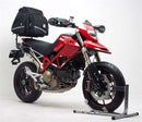 Ventura EVO-12 Bike-Pack Kit for Ducati 1100 EVO Hypermotard (10-12) includes a black bike pack, Evo-Rack mounted on a motorcycle, and an L-Bracket with hardware, each clearly labeled in the image.
