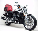 Image featuring a Ventura EVO-12 Bike-Pack Kit with an EVO-12 Pack, Evo-Rack, and L-Brackets for the 2006 Harley Davidson VRSCR 1130 Street Rod. The pack is a black storage bag, the rack has a tough metal frame, and the brackets provide robust black metal support.
