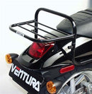 Image featuring a Ventura EVO-12 Bike-Pack Kit with an EVO-12 Pack, Evo-Rack, and L-Brackets for the 2006 Harley Davidson VRSCR 1130 Street Rod. The pack is a black storage bag, the rack has a tough metal frame, and the brackets provide robust black metal support.