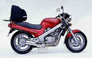 Image showcasing a Ventura EVO-12 Bike-Pack Kit for the Honda NTV 650 Revere. Features labeled components: Adjustable Pack-Rack (top left), EVO-Rack (top right), and L-Bracket with screws (bottom). Components are displayed separately.