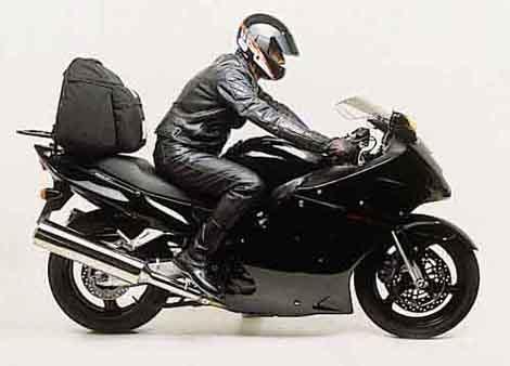 The Ventura EVO-12 Bike-Pack Kit for the Honda CBR 1100 XX Blackbird (97-07) includes a stylish black pack with red trim, an Adjustable Pack-Rack for flexible bike mounting, and an L-bracket set with screws depicted in a generic image.