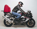 The EVO-12 Bike-Pack Kit includes a sleek black EVO-12 pack, an adjustable Evo-Rack for your Honda CBR 900 RR, Y (2000), and an L-Bracket with screws. Components are laid out on a white background and labeled for clarity by Ventura.