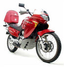 The Ventura EVO-12 Bike-Pack Kit for Honda XL 650 V Transalp (00-07) includes a sleek black and gray pack, a sturdy Evo-Rack for secure mounting, and an L-Bracket with screws for easy attachment.