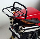 The EVO-12 Bike-Pack Kit for the Honda VFR 800 (02-12) by Ventura features a sleek black adjustable Pack-Rack and L-Bracket with bolts and screws for secure mounting, elegantly displayed against a crisp white background.