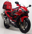 The Ventura EVO-12 Bike-Pack Kit for the Honda CBR 954 RR (02-03) includes a stylish black pack with a logo and orange stripe, mounted on an Adjustable Pack-Rack. It comes with an EVO-Rack, L-bracket, and screws, making it the ultimate biking accessory.