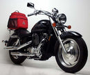 The Ventura EVO-12 Bike-Pack Kit for the Honda VT 1100 C2 Shadow Sabre (01-02) includes a sleek black pack with orange accents, an adjustable Top-Box Rack labeled "EVO-Rack," and an "L-Bracket" with small screws and tools for easy installation.