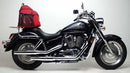 The Ventura EVO-12 Bike-Pack Kit for the Honda VT 1100 C2 Shadow Sabre (01-02) includes a sleek black pack with orange accents, an adjustable Top-Box Rack labeled "EVO-Rack," and an "L-Bracket" with small screws and tools for easy installation.