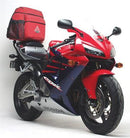 Image of the Ventura EVO-12 Bike-Pack Kit on a Honda CBR 600 RR5, RR6 Fireblade (05-06), featuring an EVO-Rack with L-Bracket and screws. A sleek black pack with zip and orange stripe highlights its adaptability with the Adjustable Pack-Rack system.