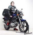 The image showcases Ventura's Honda VTR 250 (98-07) Bike-Pack Kit, featuring the versatile Pack-Rack. It includes a sleek black EVO-12 Pack securely fastened with the robust EVO-Rack on a bike, plus an L-Bracket set with all necessary screws and bolts for easy assembly.
