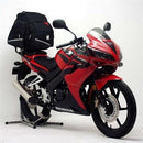The image displays a Ventura EVO-12 Bike-Pack Kit for Honda CBR 125 RW (07-09), featuring a black EVO-12 Pack with logo, an Adjustable Pack-Rack that securely attaches to the bike, and an L-Bracket with screws. Labels are shown above each item.