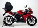 The image displays a Ventura EVO-12 Bike-Pack Kit for Honda CBR 125 RW (07-09), featuring a black EVO-12 Pack with logo, an Adjustable Pack-Rack that securely attaches to the bike, and an L-Bracket with screws. Labels are shown above each item.