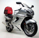 The Ventura EVO-12 Bike-Pack Kit for Kawasaki ZZR 1200 (01-05) includes a sleek black pack labeled "EVO-12 Pack," an adaptable "Adjustable Pack-Rack" bike rack, and sturdy metal components labeled "L-BRACKET," all showcased on a pristine white background.
