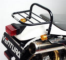 Image showcasing Ventura's EVO-12 Bike-Pack Kit for the Kawasaki KL 250 Super Sherpa (97-04), featuring three components: a black EVO-12 pack, an adjustable Pack-Rack for your bike, and a labeled L-bracket, displayed as a generic image.