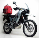 The Ventura EVO-12 Bike-Pack Kit for the KTM 640 LC4 Adventure (03-07) includes a sleek black EVO-12 pack with orange accents, a versatile black Evo-Rack, and an L-bracket with screws for secure mounting.