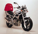 Image showing three labeled components of the Ventura EVO-12 Bike-Pack Kit for Suzuki GSF 250 V X Bandit: EVO-12 pack (black bag), Evo-Rack Top-Box Rack on bike, and a black L-Bracket with screws.