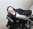 Image showing three labeled components of the Ventura EVO-12 Bike-Pack Kit for Suzuki GSF 250 V X Bandit: EVO-12 pack (black bag), Evo-Rack Top-Box Rack on bike, and a black L-Bracket with screws.