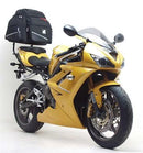 Image showing three Ventura accessories for Triumph Daytona Triple 675 (09-12): EVO-12 pack (black zippered bag), Evo-Rack Adjustable Pack-Rack (installed on bike), and L-Bracket ("Generic Image," black metal bracket with screws).