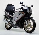 The Ventura EVO-12 Bike-Pack Kit for Yamaha FZR 250 includes a black EVO-12 pack, a black adjustable pack-rack installed on the bike, and a generic L-bracket image with screws and mounting hardware.