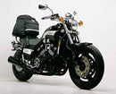 Image showing the Ventura EVO-12 Bike-Pack Kit for Yamaha VMX 1200 J V-Max with three labeled parts: EVO-12 Pack (black storage bag), Evo-Rack (adjustable pack rack), and L-Bracket (metal support bars, generic image).