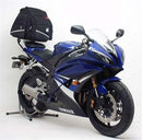 The Ventura EVO-12 Bike-Pack Kit for Yamaha YZF 600 R6 V-D (06-14) includes an EVO-12 pack, Evo-Rack fitted to the bike, and a black L-bracket with screws. Each item is labeled in red with its product name for easy identification.