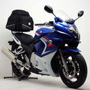 The Ventura EVO-12 Bike-Pack Kit for Suzuki GSX 650F (07-16) includes an EVO-12 pack, Evo-Rack Top-Box Rack, and a black L-bracket with screws and hardware.