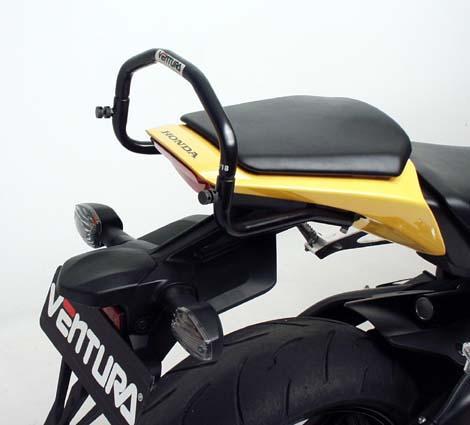The EVO-12 Bike-Pack Kit for the Honda CBR 1000 RR Fireblade (08-11) by Ventura includes a sleek black EVO-12 pack, a durable Evo-Rack, and an L-Bracket with screws. Displayed on a motorcycle, it highlights the versatile Evo-Rack and shows the L-Bracket separately for clarity.