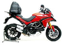 A Ventura EVO-12 bike-pack, Evo-Rack mounted on a Ducati 1200 Multistrada (10-14), and L-brackets with screws are displayed on a white background, each labeled. Text above says "EVO-12 Bike-Pack Kit.