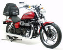 Ventura’s EVO-12 Bike-Pack Kit for Triumph Speedmaster 865 (11-15) includes a black EVO-12 pack, Evo-Rack Top-Box Rack, and an L-bracket with hardware. All items are clearly labeled for easy identification.