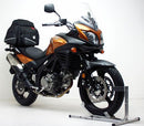 The image features the Ventura EVO-12 Bike-Pack Kit for Suzuki DL 650 V-Strom (12-16), showcasing a sleek black EVO-12 pack with a logo, an Evo-Rack mounted on the bike, and an L-Bracket with screws, all expertly assembled to elevate your biking experience.