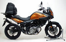 The image features the Ventura EVO-12 Bike-Pack Kit for Suzuki DL 650 V-Strom (12-16), showcasing a sleek black EVO-12 pack with a logo, an Evo-Rack mounted on the bike, and an L-Bracket with screws, all expertly assembled to elevate your biking experience.