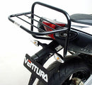 The Ventura Pack Kit for the Aprilia Dorsoduro 1200 (11-15) includes a sleek black EVO-12 PAC bike pack, an Evo-Rack metal bike rack, and a set of L-brackets with screws, all depicted in a generic image.