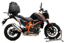 Image showcases the Ventura Kit for KTM 690 Duke (12-16): a sleek black EVO-12 pack with an orange stripe, an EVO-Rack, and a versatile L-Bracket complete with screws.