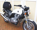 The image features the Ventura EVO-12 Bike-Pack Kit for Honda CB 1100 (10-15), including a black EVO-12 Pack with logo, a metal Top-Box Rack fitted on the bike, and an L-bracket with screws.