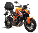 Image of an EVO-12 Bike-Pack Kit including an EVO-12 Pack, Evo-Rack, and L-Bracket with screws. The black and orange bag complements the sturdy black metal frame of the adjustable Top-Box Rack. Product Name: KTM 1290 SuperDuke R (14-19). Brand: Ventura.